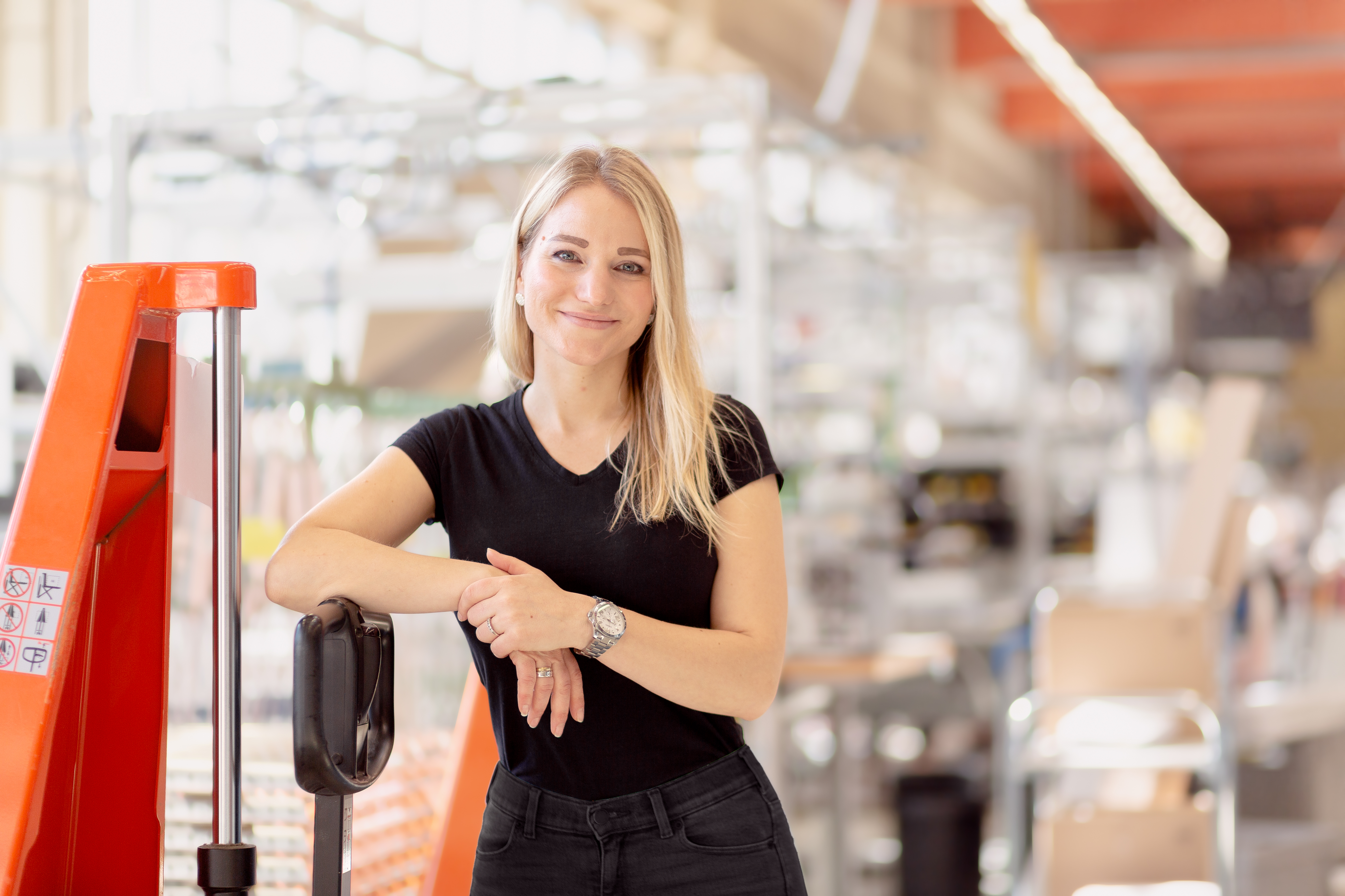 Woman leaning on jack trolley.jpg