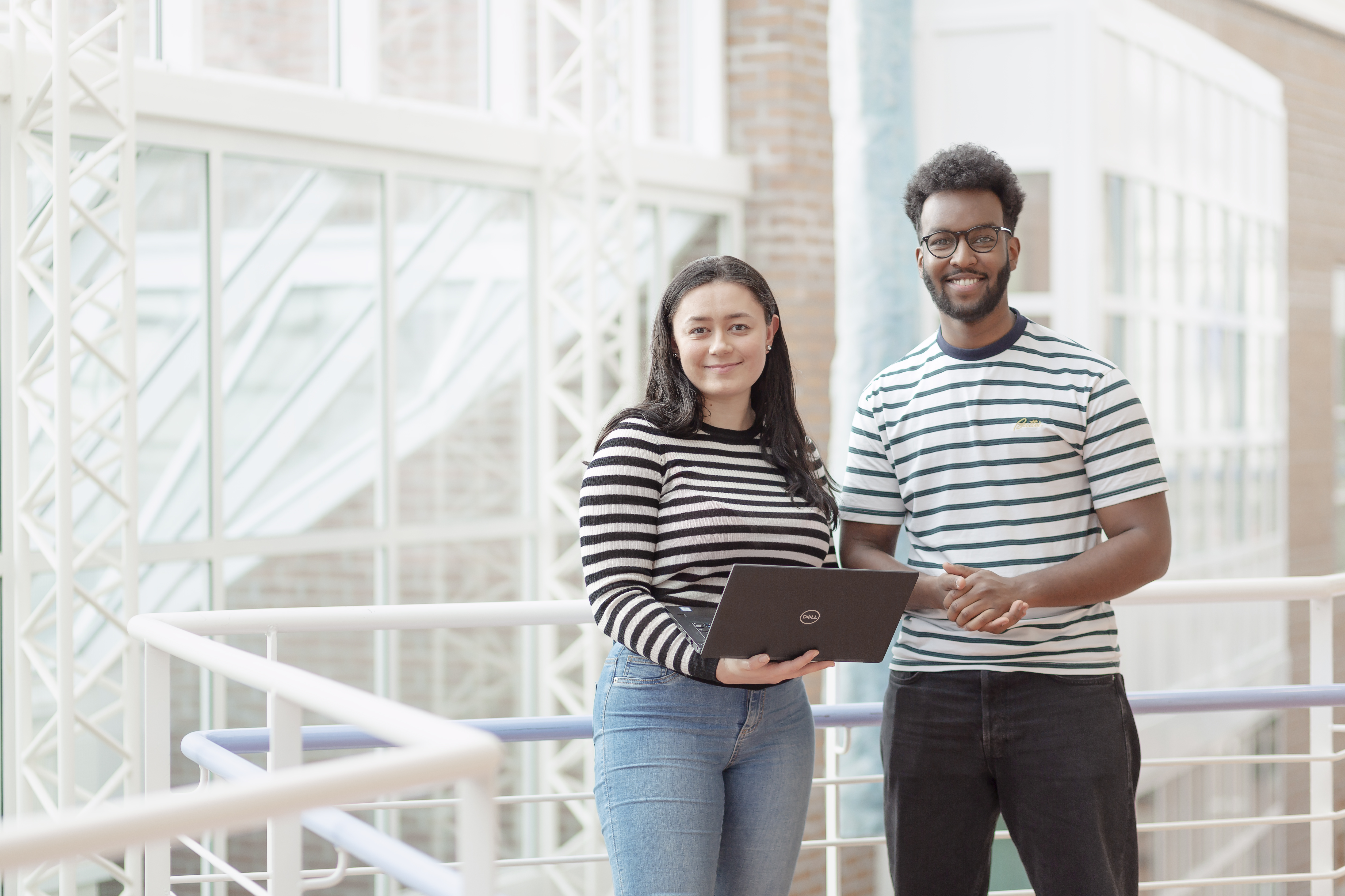 Woman and man standing together in open area.jpg