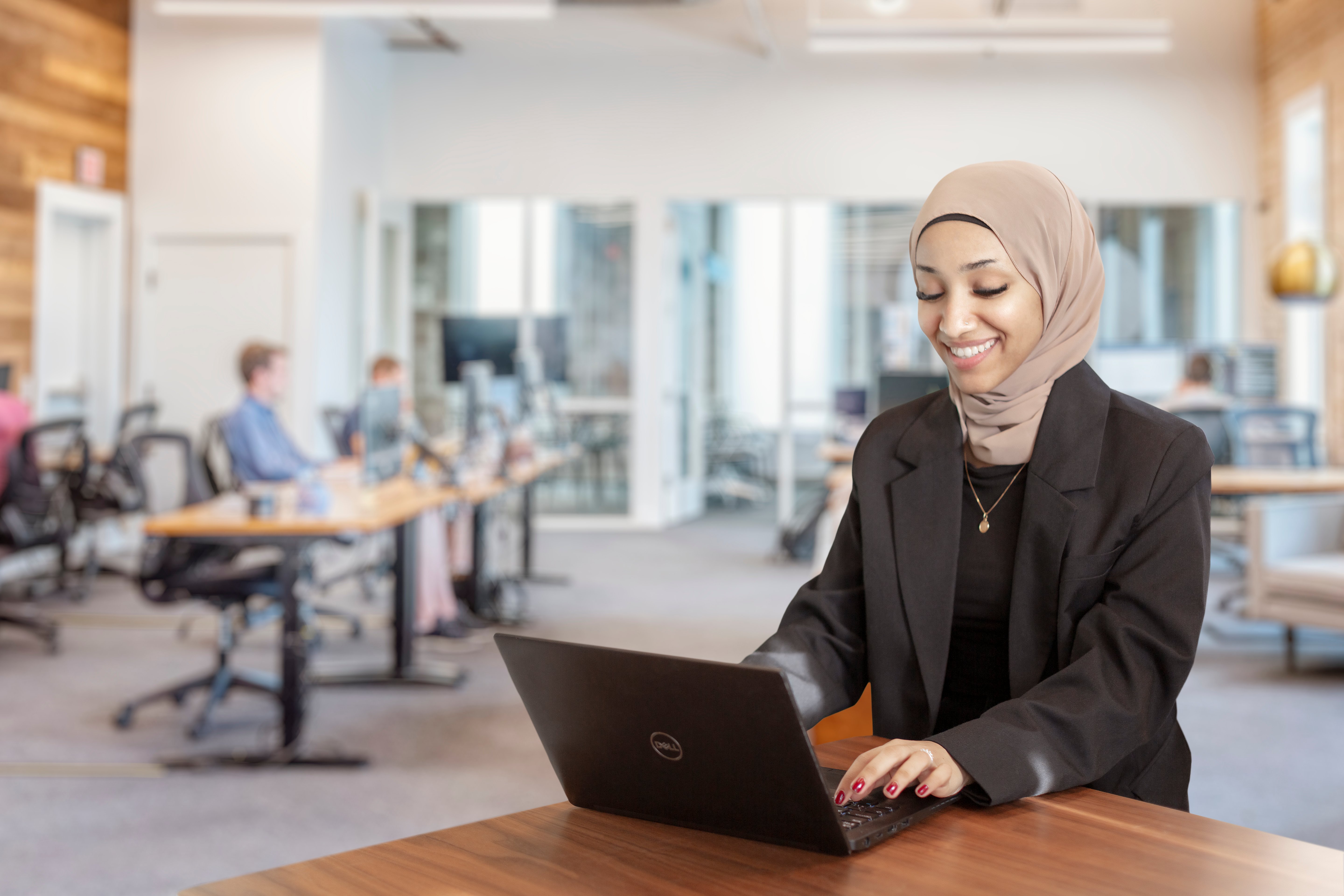 Woman working on pc in office environment.jpg