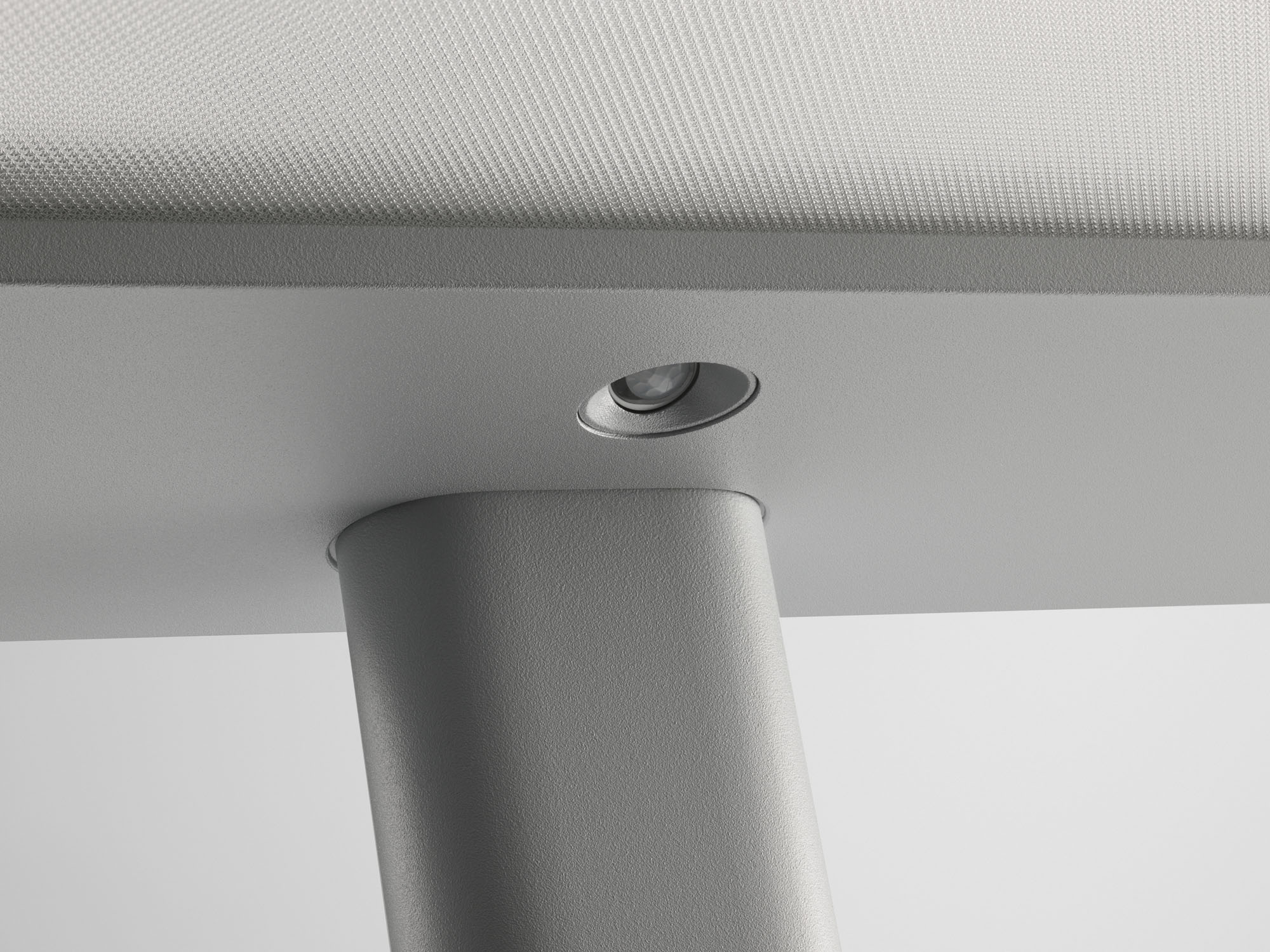 Close up of the sensor on a grey luminaire