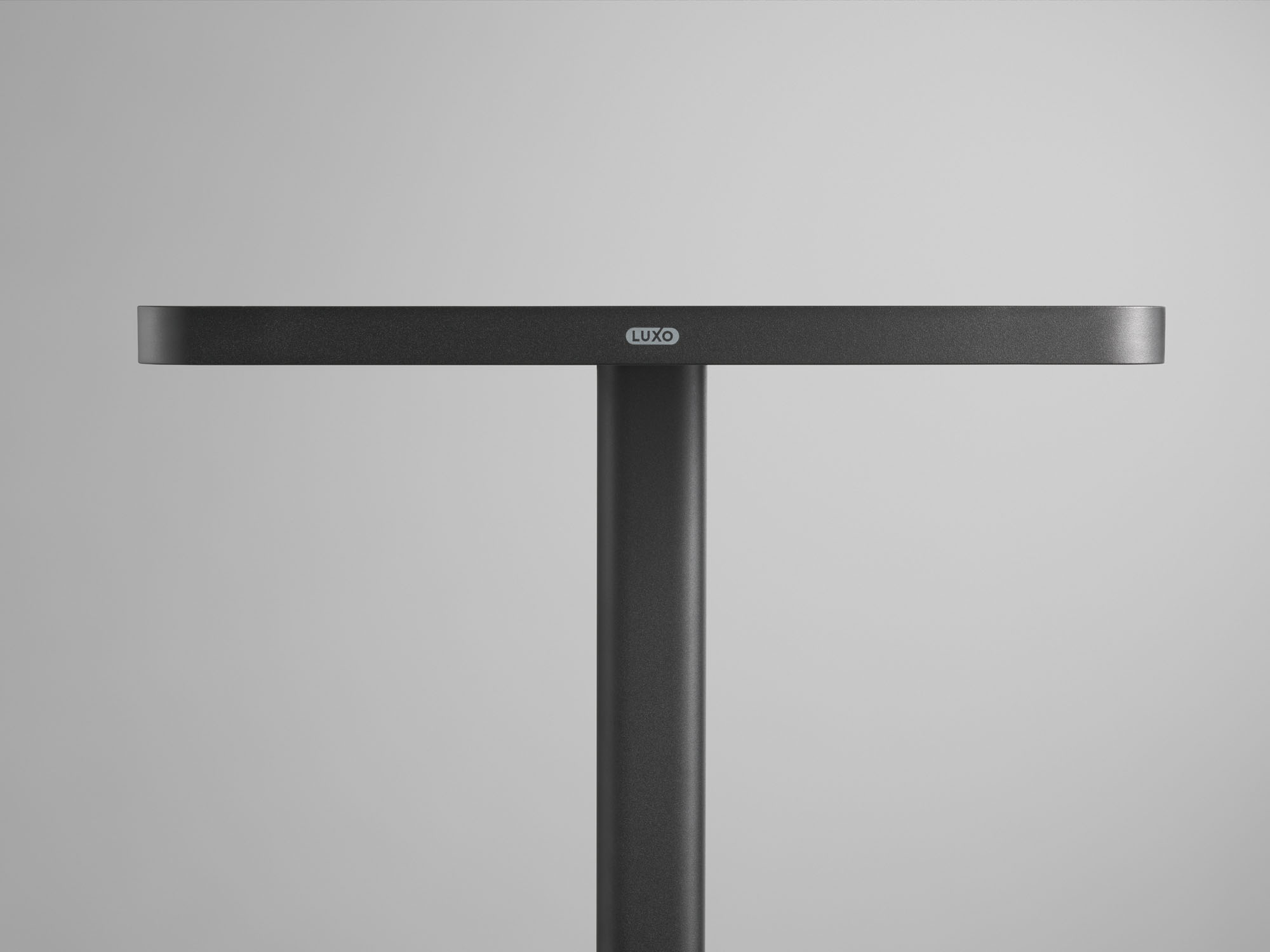 Close up of the head of a black luminaire from backside