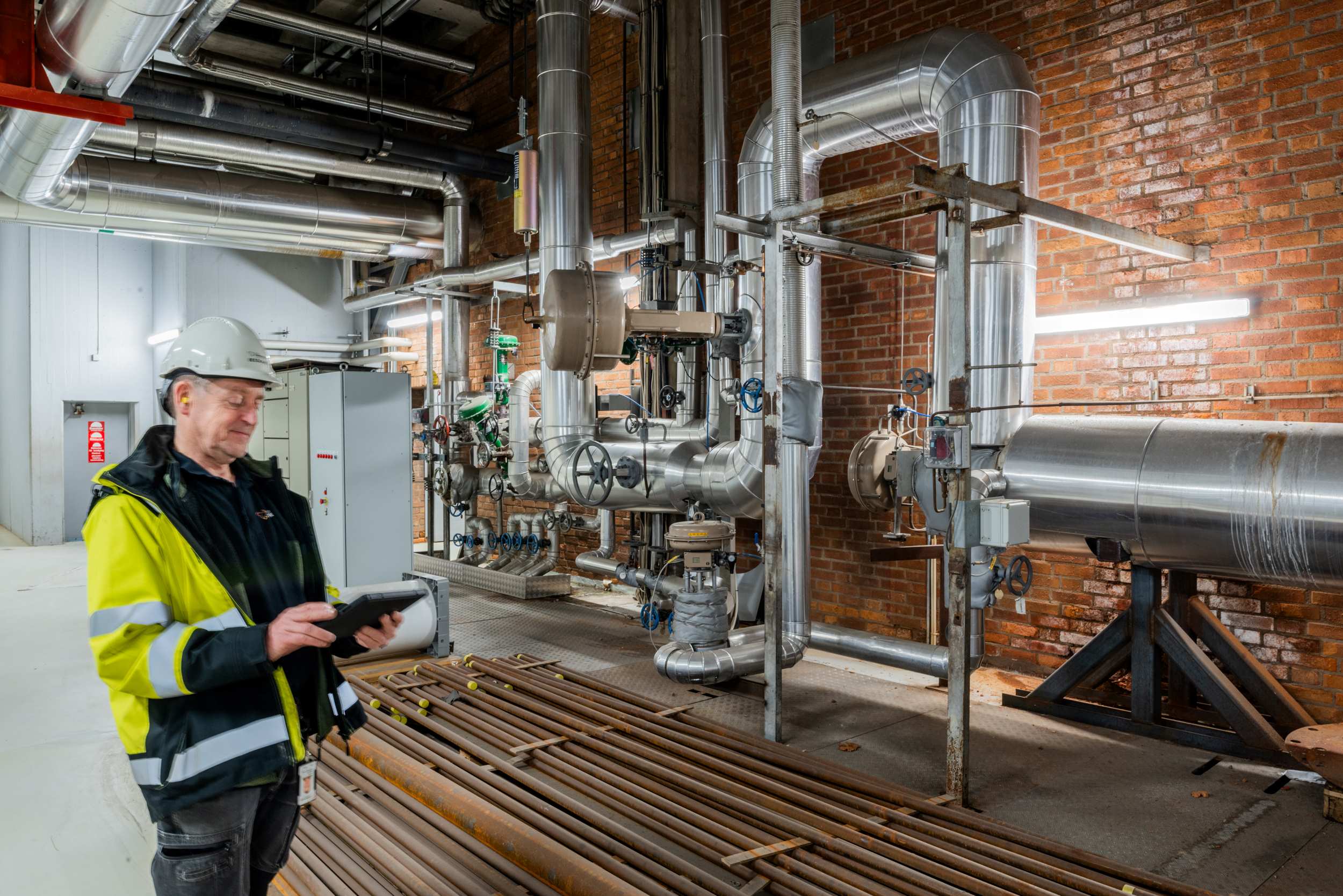 Ronny Sidenvik_ Energy Engineer managing smart lighting using a tablet Photo Credit_ Catharina Fyrberg.jpg